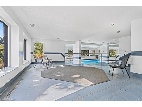 409-675 Davis Drive, Kingston, ON -  Photo Showing Other Room With In Ground Pool