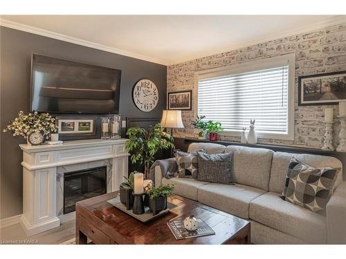 1101-237 Oak Street, Gananoque, ON - Indoor Photo Showing Living Room With Fireplace