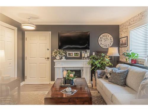 1101-237 Oak Street, Gananoque, ON - Indoor Photo Showing Living Room With Fireplace