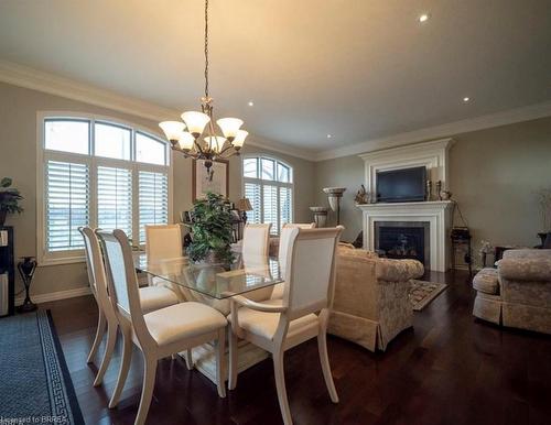 10-68 Fairview Drive, Brantford, ON - Indoor Photo Showing Dining Room With Fireplace