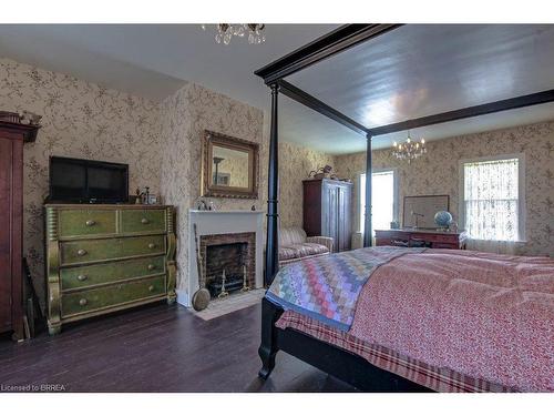 52 Grand River Street S, Paris, ON - Indoor Photo Showing Bedroom With Fireplace