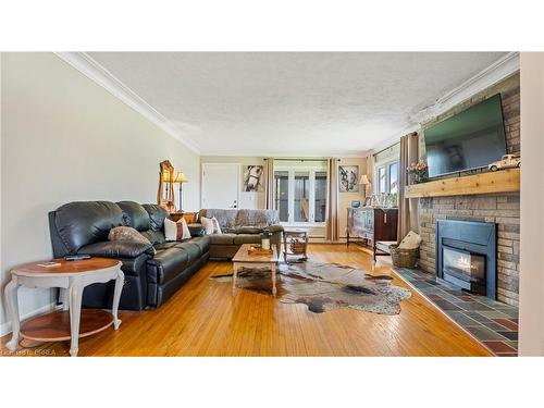 1039 St John'S Road W, Walsh, ON - Indoor Photo Showing Living Room With Fireplace
