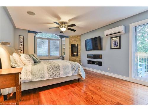 259 Blueline Road, Norfolk County, ON - Indoor Photo Showing Bedroom With Fireplace