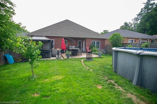 466 Queen Street S, Simcoe, ON - Outdoor With Above Ground Pool With Deck Patio Veranda