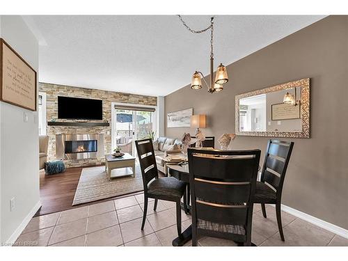 180 Thomas Avenue, Brantford, ON - Indoor Photo Showing Dining Room With Fireplace