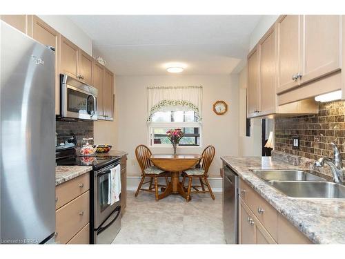 506-11 Mill Pond Court, Simcoe, ON - Indoor Photo Showing Kitchen With Double Sink