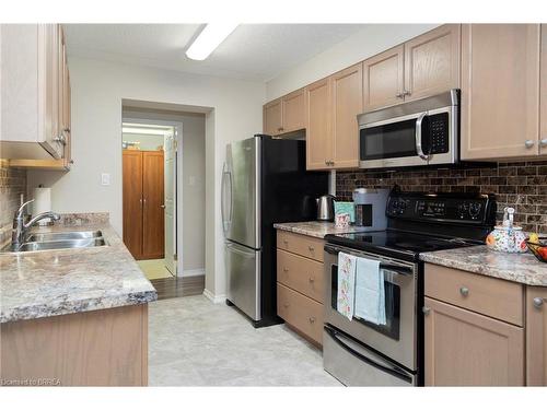 506-11 Mill Pond Court, Simcoe, ON - Indoor Photo Showing Kitchen With Double Sink