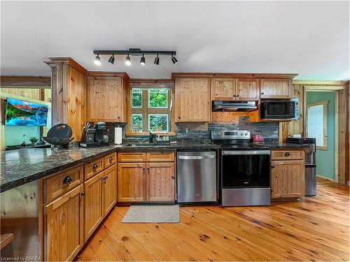 31 Fowke Lake Road, Lount, ON - Indoor Photo Showing Kitchen With Fireplace