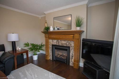 15 Pinto Court, Brantford, ON - Indoor Photo Showing Living Room With Fireplace