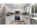 5-7 Southside Place, Hamilton, ON  - Indoor Photo Showing Kitchen With Double Sink 