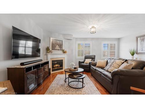 5-7 Southside Place, Hamilton, ON - Indoor Photo Showing Living Room With Fireplace