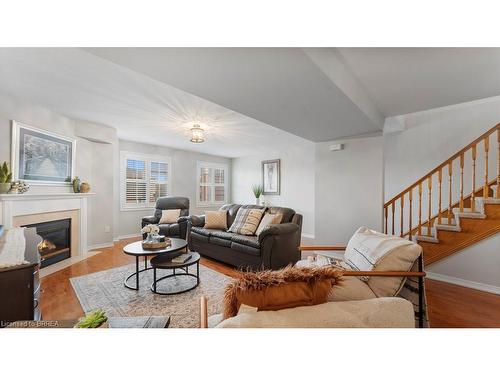 5-7 Southside Place, Hamilton, ON - Indoor Photo Showing Living Room With Fireplace