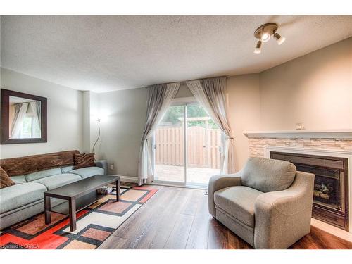 11-139 Stanley Street, Brantford, ON - Indoor Photo Showing Living Room With Fireplace