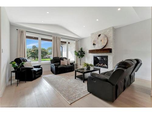 16 St Ladislaus Street, Courtland, ON - Indoor Photo Showing Living Room With Fireplace