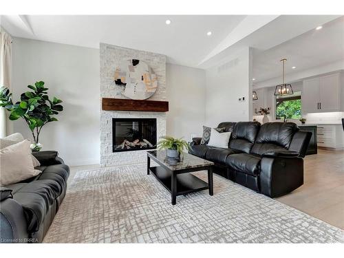 16 St Ladislaus Street, Courtland, ON - Indoor Photo Showing Living Room With Fireplace