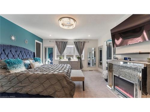 26 Doug Foulds Way, Paris, ON - Indoor Photo Showing Bedroom With Fireplace