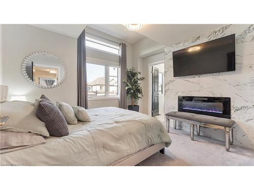 26 Doug Foulds Way, Paris, ON - Indoor Photo Showing Bedroom With Fireplace