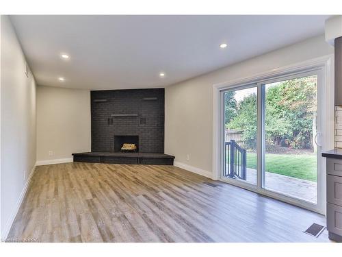 22 Atwood Crescent, Simcoe, ON - Indoor Photo Showing Living Room With Fireplace