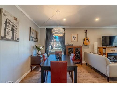 21 Wade Avenue, Brantford, ON - Indoor Photo Showing Dining Room With Fireplace