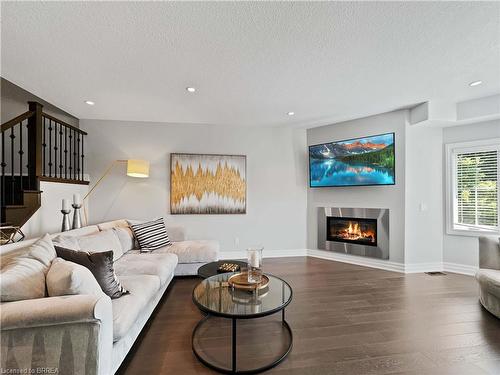 16-60 Dufferin Avenue, Brantford, ON - Indoor Photo Showing Living Room With Fireplace