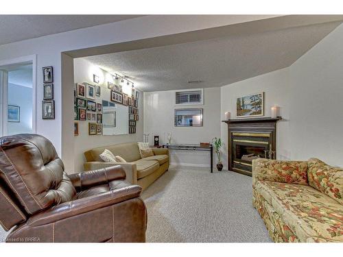 F-144 Wood Street, Brantford, ON - Indoor Photo Showing Living Room With Fireplace