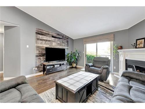 19-15 Cobden Court, Brantford, ON - Indoor Photo Showing Living Room With Fireplace