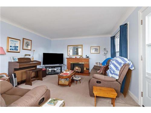 1 Grand River Avenue, Brantford, ON - Indoor Photo Showing Living Room With Fireplace