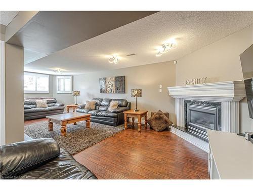 32 Mcintosh Court, Brantford, ON - Indoor Photo Showing Living Room With Fireplace