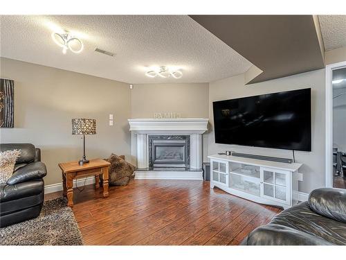 32 Mcintosh Court, Brantford, ON - Indoor Photo Showing Living Room With Fireplace