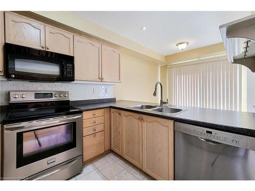 17-220 Blackburn Drive, Brantford, ON - Indoor Photo Showing Kitchen With Stainless Steel Kitchen With Double Sink