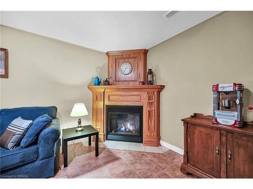 14-633 Park Road N, Brantford, ON - Indoor Photo Showing Living Room With Fireplace