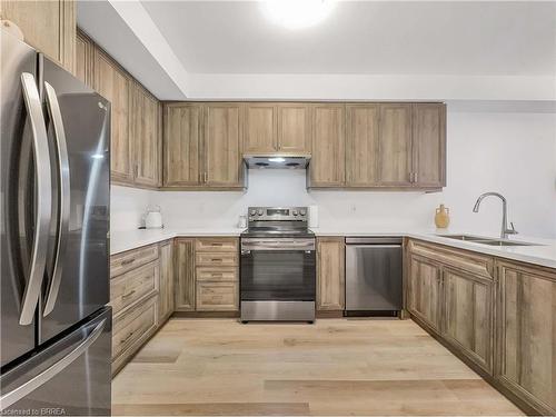 119-461 Blackburn Drive, Brantford, ON - Indoor Photo Showing Kitchen With Stainless Steel Kitchen With Double Sink