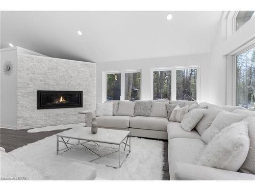 1814 Riding Ranch Road, South River, ON - Indoor Photo Showing Living Room With Fireplace