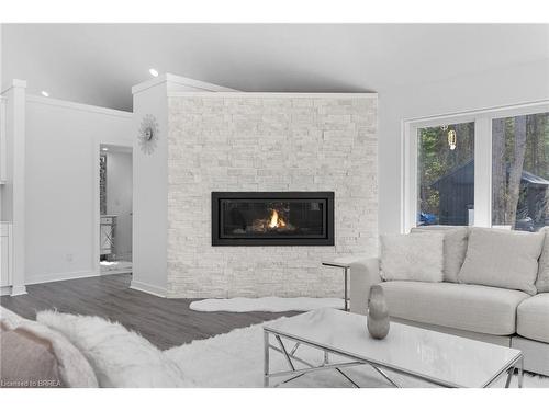 1814 Riding Ranch Road, South River, ON - Indoor Photo Showing Living Room With Fireplace