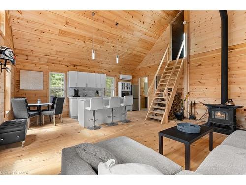 1814 Riding Ranch Road, South River, ON - Indoor Photo Showing Living Room With Fireplace