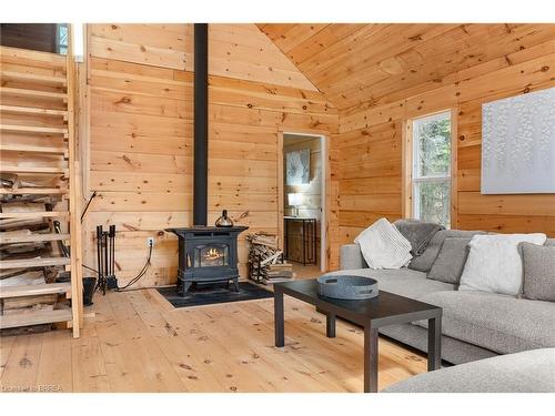 1814 Riding Ranch Road, South River, ON - Indoor Photo Showing Living Room With Fireplace