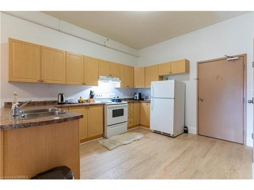 405-150 Colborne Street E, Brantford, ON - Indoor Photo Showing Kitchen With Double Sink