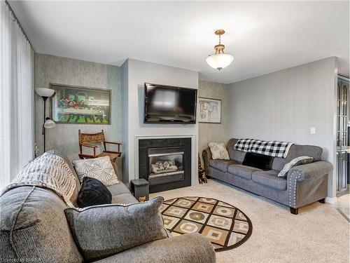 3 Johnson Crescent, Simcoe, ON - Indoor Photo Showing Living Room With Fireplace