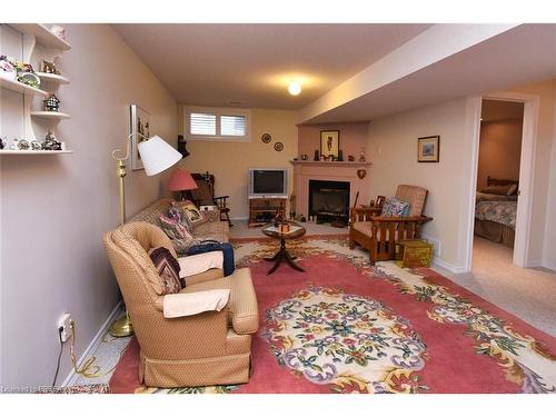 28-19 Hanlon Place, Paris, ON - Indoor Photo Showing Living Room With Fireplace