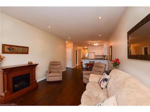 52-10 Cobblestone Drive, Paris, ON - Indoor Photo Showing Living Room With Fireplace