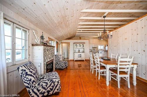 57 Erie Boulevard, Long Point, ON - Indoor Photo Showing Dining Room With Fireplace