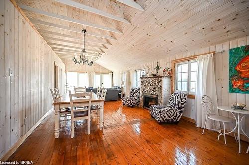 57 Erie Boulevard, Long Point, ON - Indoor Photo Showing Dining Room With Fireplace