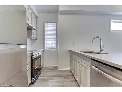 110-461 Blackburn Drive, Brantford, ON - Indoor Photo Showing Kitchen With Double Sink