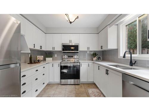 5-7 Southside Place, Hamilton, ON - Indoor Photo Showing Kitchen With Double Sink