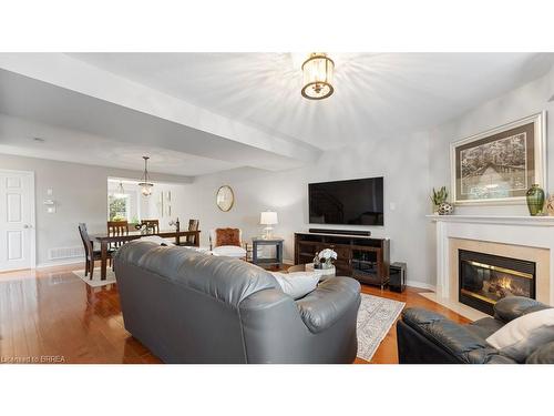 5-7 Southside Place, Hamilton, ON - Indoor Photo Showing Living Room With Fireplace