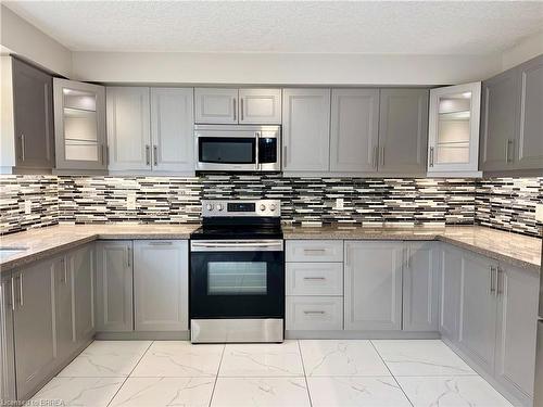 687 Spitfire Street, Woodstock, ON - Indoor Photo Showing Kitchen With Upgraded Kitchen