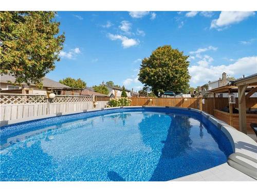 34 Sympatica Crescent, Brantford, ON - Outdoor With Above Ground Pool With Backyard