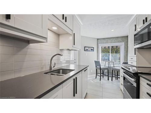 23 Freeman Crescent, Simcoe, ON - Indoor Photo Showing Kitchen With Double Sink