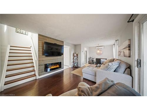 23 Freeman Crescent, Simcoe, ON - Indoor Photo Showing Living Room With Fireplace