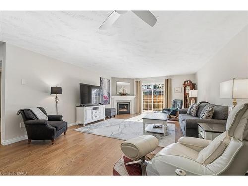 31-53 Heron'S Landing, Woodstock, ON - Indoor Photo Showing Living Room With Fireplace